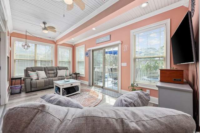 living area featuring ornamental molding, wood finished floors, recessed lighting, baseboards, and ceiling fan