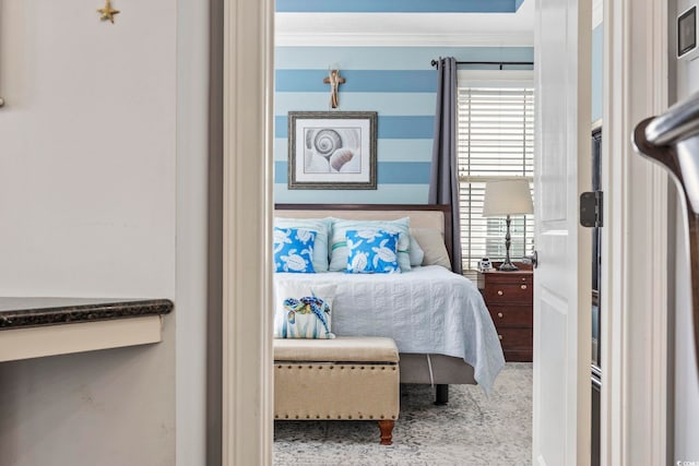 bedroom with crown molding and carpet floors