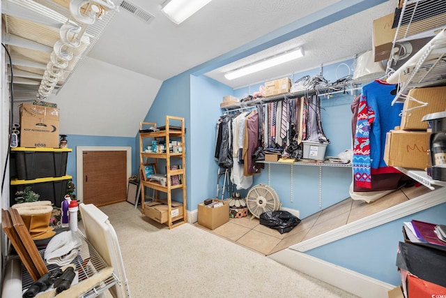 interior space with lofted ceiling and visible vents