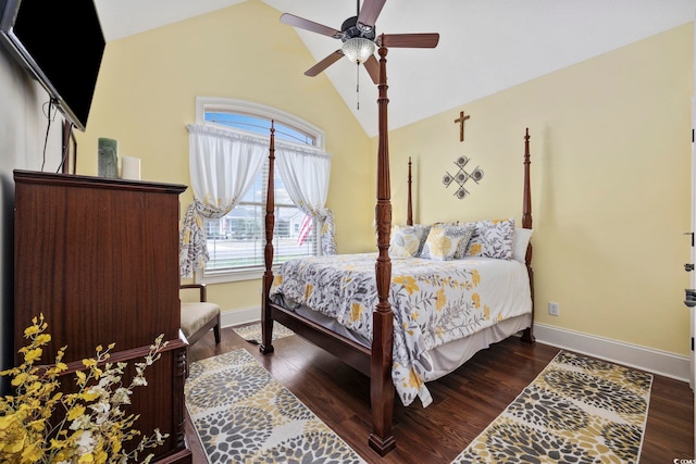 bedroom with ceiling fan, baseboards, dark wood finished floors, and vaulted ceiling