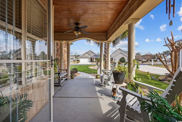 view of patio / terrace with a residential view and a ceiling fan