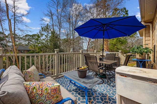 wooden deck with outdoor dining area