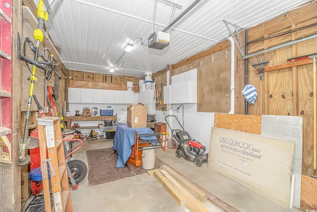 garage featuring a workshop area and a garage door opener