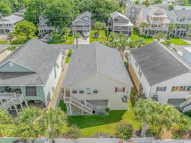 birds eye view of property with a residential view