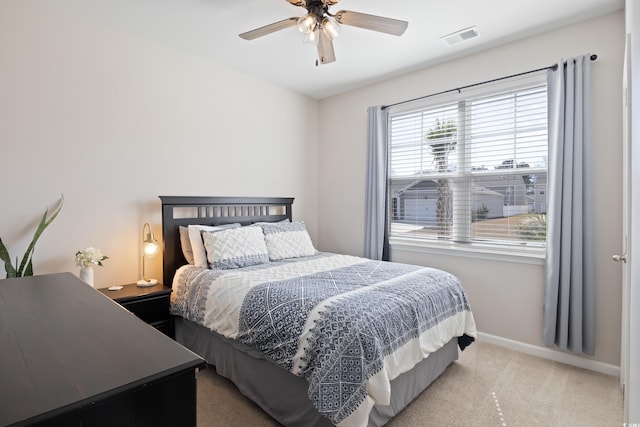 bedroom featuring carpet floors, baseboards, and ceiling fan