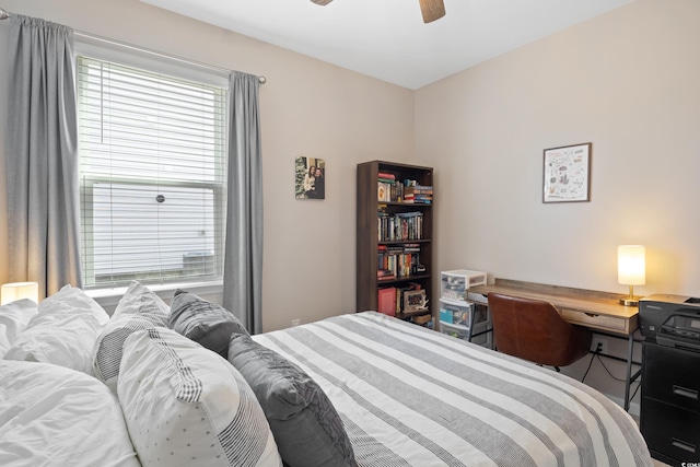 bedroom with ceiling fan and a desk