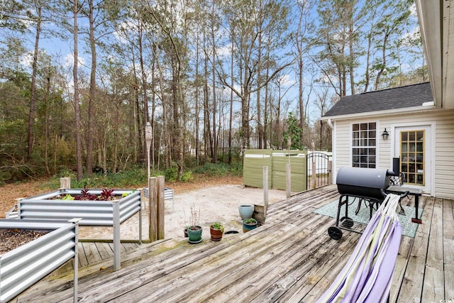 wooden terrace with area for grilling