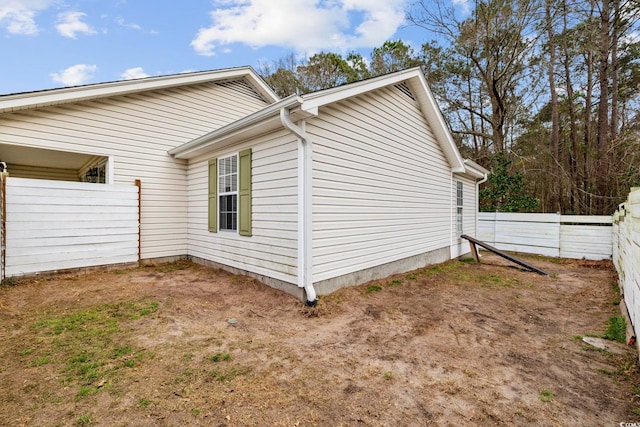 view of property exterior with fence