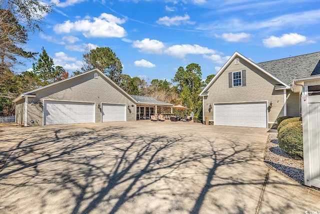 exterior space with a garage and concrete driveway