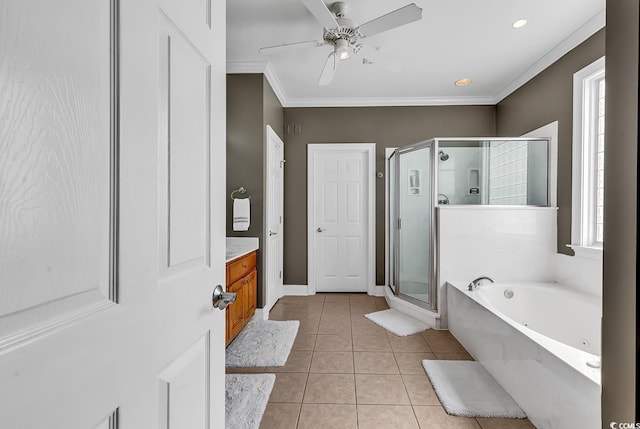 full bathroom with tile patterned floors, a whirlpool tub, a ceiling fan, ornamental molding, and a stall shower
