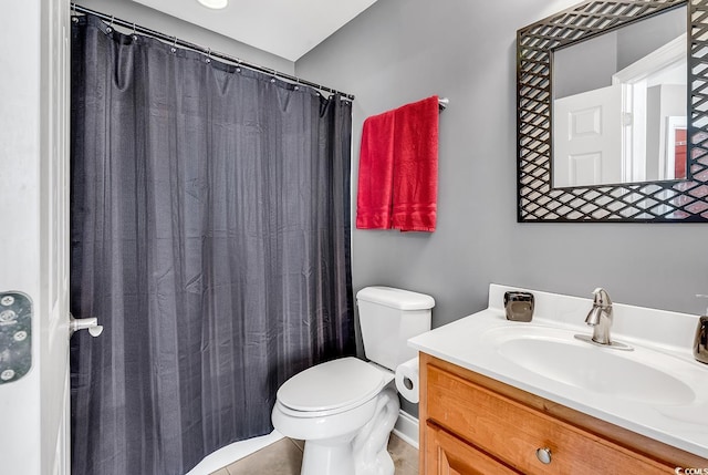 full bathroom featuring vanity, tile patterned flooring, and toilet