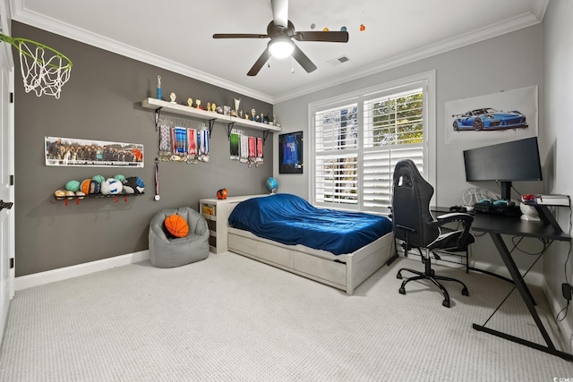 carpeted bedroom featuring visible vents, a ceiling fan, baseboards, and ornamental molding