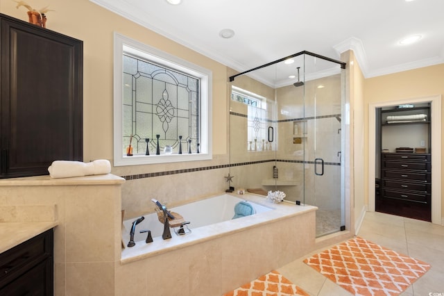 full bath featuring tile patterned flooring, a shower stall, crown molding, a garden tub, and vanity