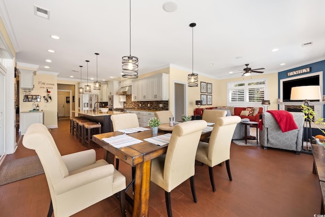 dining area featuring crown molding, recessed lighting, a ceiling fan, and visible vents