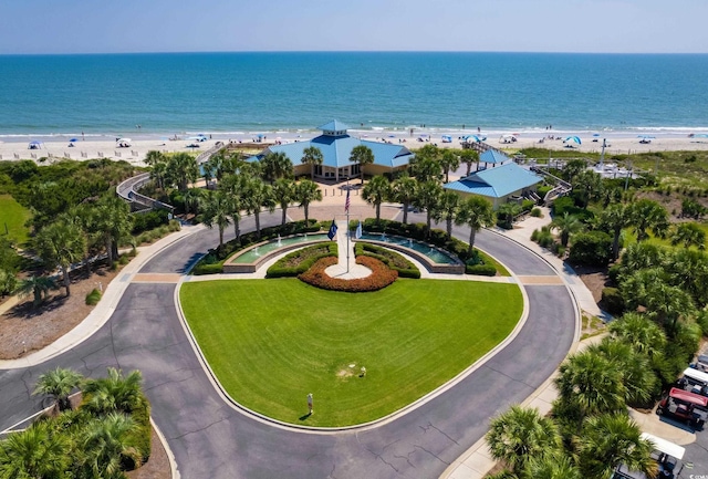 aerial view featuring a view of the beach and a water view