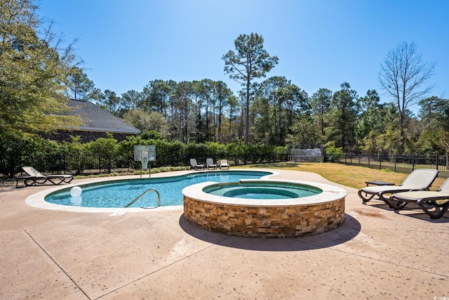 view of swimming pool with a patio area, fence, and a fenced in pool