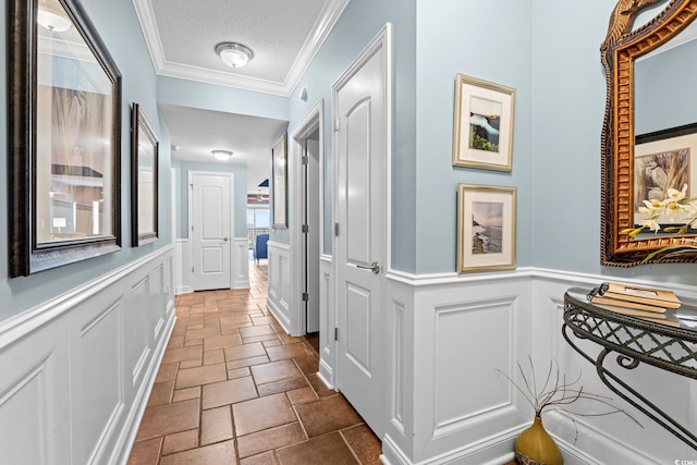 100 N Beach Blvd Unit 1608, North Myrtle Beach, SC 29582 - corridor featuring a decorative wall, stone tile floors, crown molding, and wainscoting