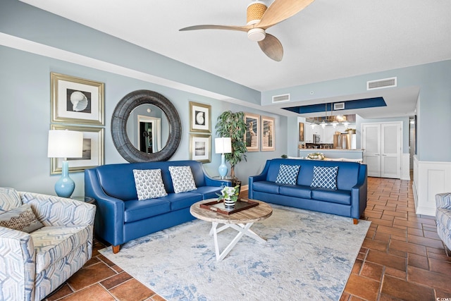100 N Beach Blvd Unit 1608, North Myrtle Beach, SC 29582 - living area with a ceiling fan and wainscoting