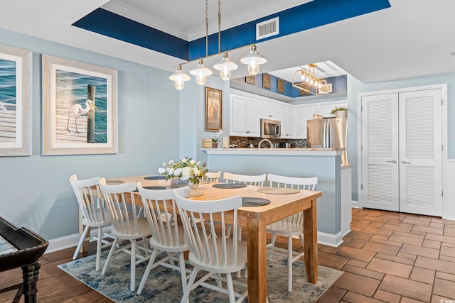 100 N Beach Blvd Unit 1608, North Myrtle Beach, SC 29582 - dining room featuring crown molding and baseboards