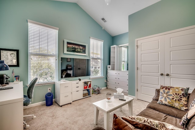 interior space featuring visible vents, baseboards, and lofted ceiling