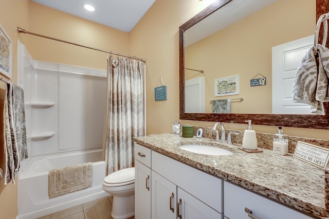 bathroom featuring tile patterned floors, vanity, toilet, and shower / bath combo with shower curtain