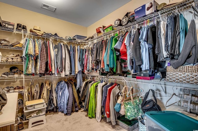 spacious closet with visible vents and carpet floors