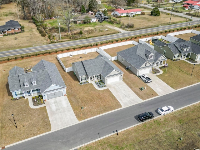 birds eye view of property with a residential view