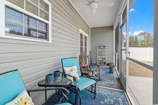 sunroom / solarium with ceiling fan