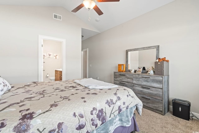 carpeted bedroom featuring visible vents, ensuite bath, ceiling fan, and vaulted ceiling