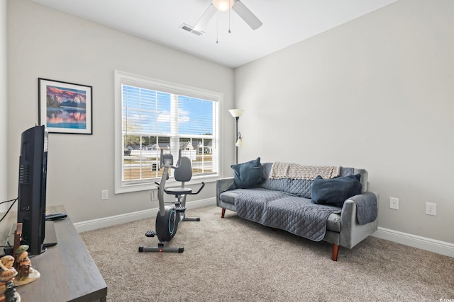 interior space with visible vents, baseboards, and ceiling fan