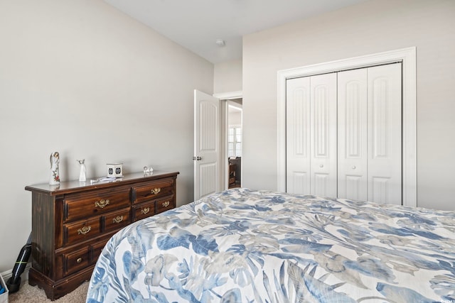 carpeted bedroom featuring a closet