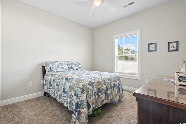 carpeted bedroom with baseboards, visible vents, and ceiling fan