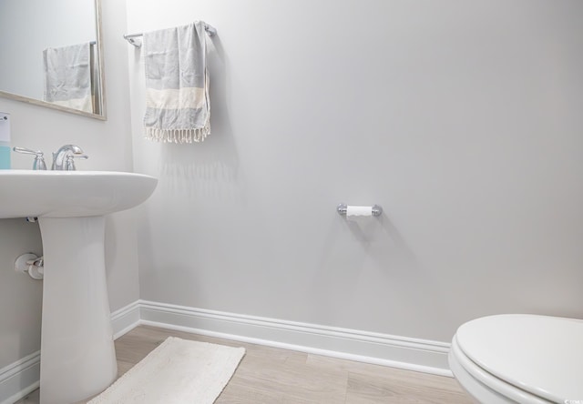 404 Cattle Drive Cir, Myrtle Beach, SC 29588 - bathroom featuring baseboards, a sink, and toilet