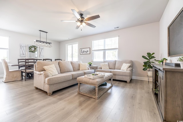 404 Cattle Drive Cir, Myrtle Beach, SC 29588 - living area featuring baseboards, ceiling fan, visible vents, and light wood-style flooring