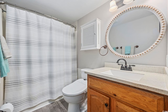 501 Maison Dr Unit F-1, Myrtle Beach, SC 29572 - full bathroom featuring toilet, wood finished floors, vanity, and a shower with curtain
