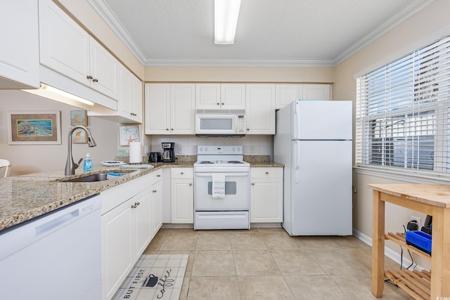 kitchen with ornamental molding, a sink, backsplash, white cabinetry, and white appliances