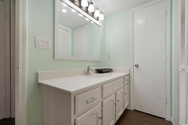 508-B Rosemary Ln, North Myrtle Beach, SC 29582 - bathroom featuring vanity, wood finished floors, and a closet