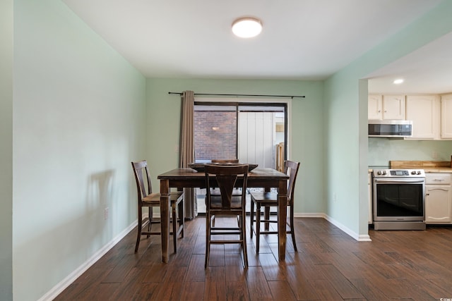 508-B Rosemary Ln, North Myrtle Beach, SC 29582 - dining area featuring baseboards and dark wood-style floors