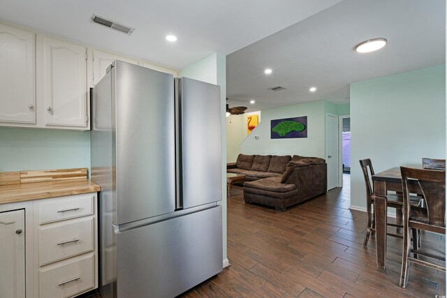 508-B Rosemary Ln, North Myrtle Beach, SC 29582 - kitchen with freestanding refrigerator, dark wood-type flooring, white cabinetry, light countertops, and recessed lighting