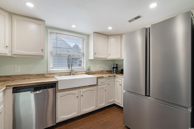 508-B Rosemary Ln, North Myrtle Beach, SC 29582 - kitchen featuring stainless steel appliances, a sink, dark wood finished floors, butcher block countertops, and recessed lighting