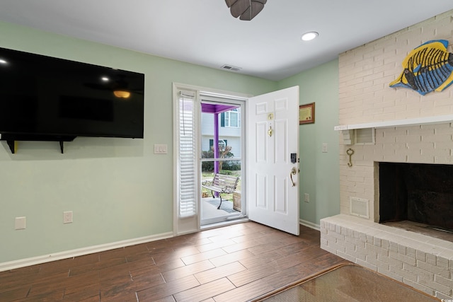 508-B Rosemary Ln, North Myrtle Beach, SC 29582 - entrance foyer with wood finished floors, baseboards, a fireplace, and recessed lighting