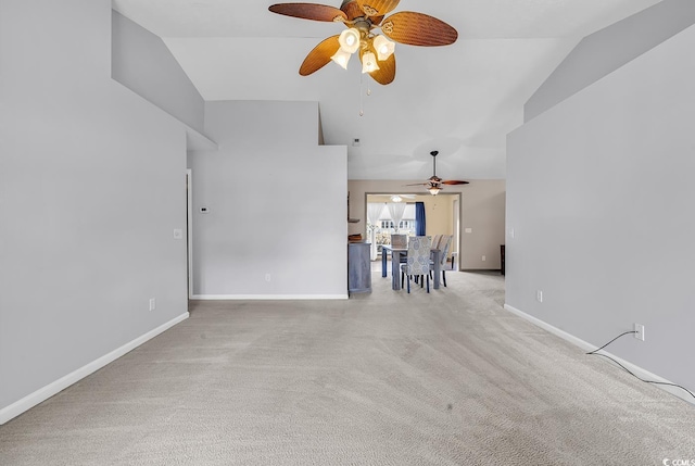 unfurnished living room with baseboards, a ceiling fan, carpet flooring, and vaulted ceiling