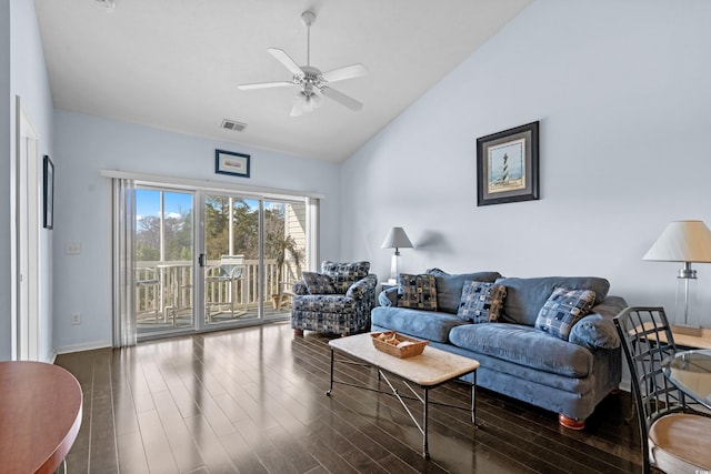 living room featuring vaulted ceiling, visible vents, ceiling fan, and wood finished floors