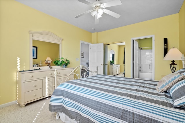 carpeted bedroom with a ceiling fan, baseboards, a closet, and connected bathroom