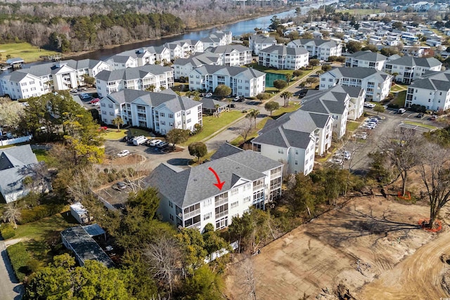 aerial view with a residential view and a water view