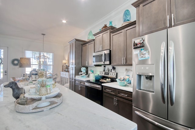 622 Lorenzo Dr Unit 622, North Myrtle Beach, SC 29582 - kitchen with appliances with stainless steel finishes, crown molding, a chandelier, dark brown cabinetry, and pendant lighting