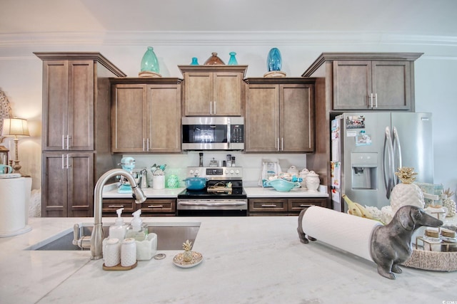 622 Lorenzo Dr Unit 622, North Myrtle Beach, SC 29582 - kitchen featuring appliances with stainless steel finishes, crown molding, and light stone countertops