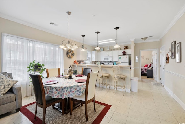 4142 Hibiscus Dr Unit 104, Little River, SC 29566 - dining room with light tile patterned floors, ornamental molding, and a chandelier