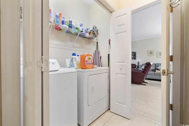4142 Hibiscus Dr Unit 104, Little River, SC 29566 - laundry area featuring separate washer and dryer, ornamental molding, and light tile patterned floors