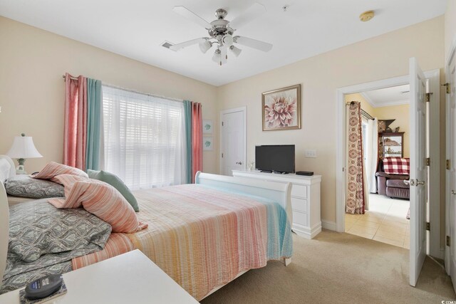 4142 Hibiscus Dr Unit 104, Little River, SC 29566 - bedroom with light colored carpet, a ceiling fan, and light tile patterned floors
